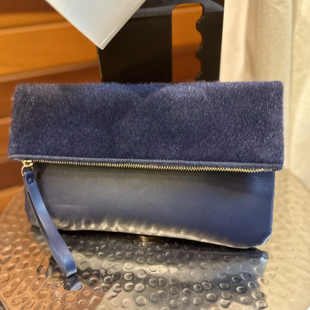 Navy blue clutch/ wristlet.  Faux fur and vegan leather.  Old Navy.